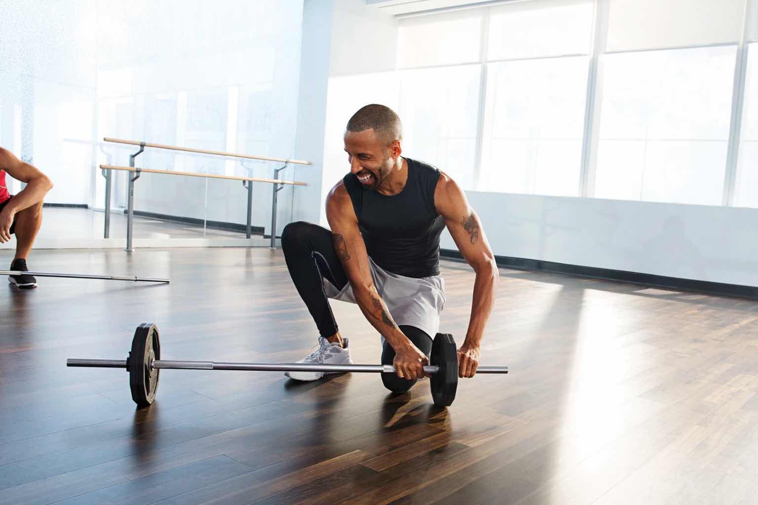 a man about to lift a dumbbell