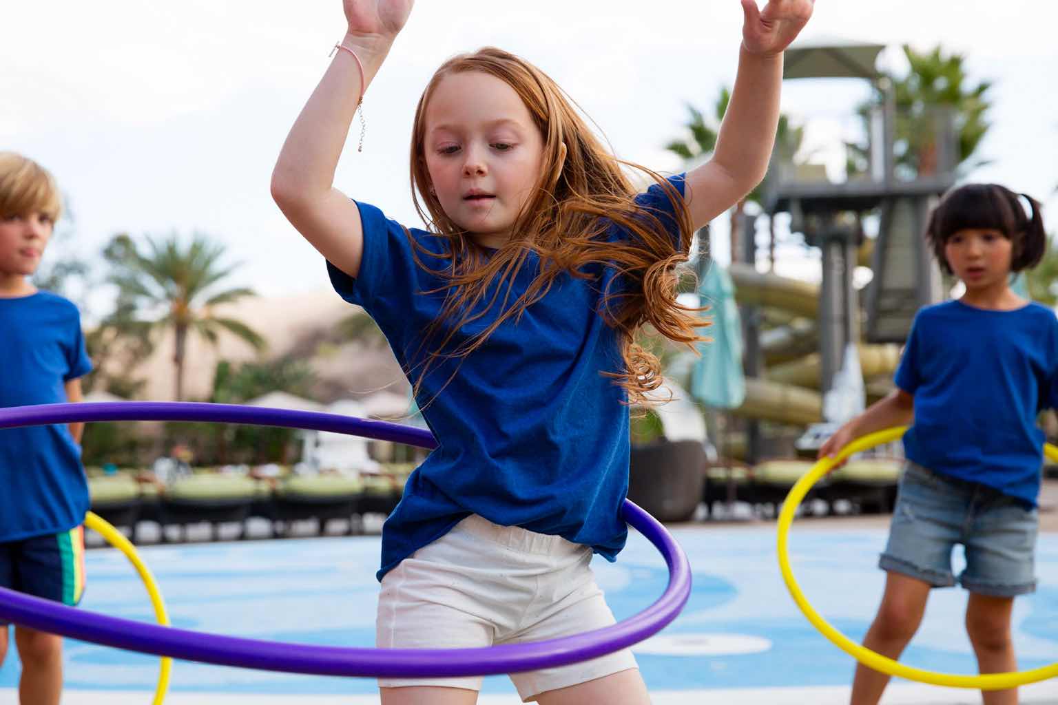 a little girl with a hula hoop