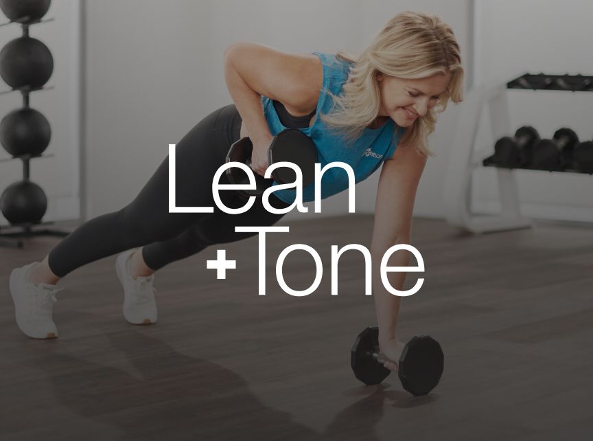 a woman planking with dumbbells