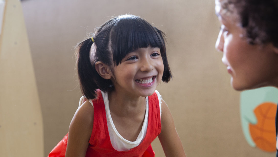 A woman playing games with a young girl