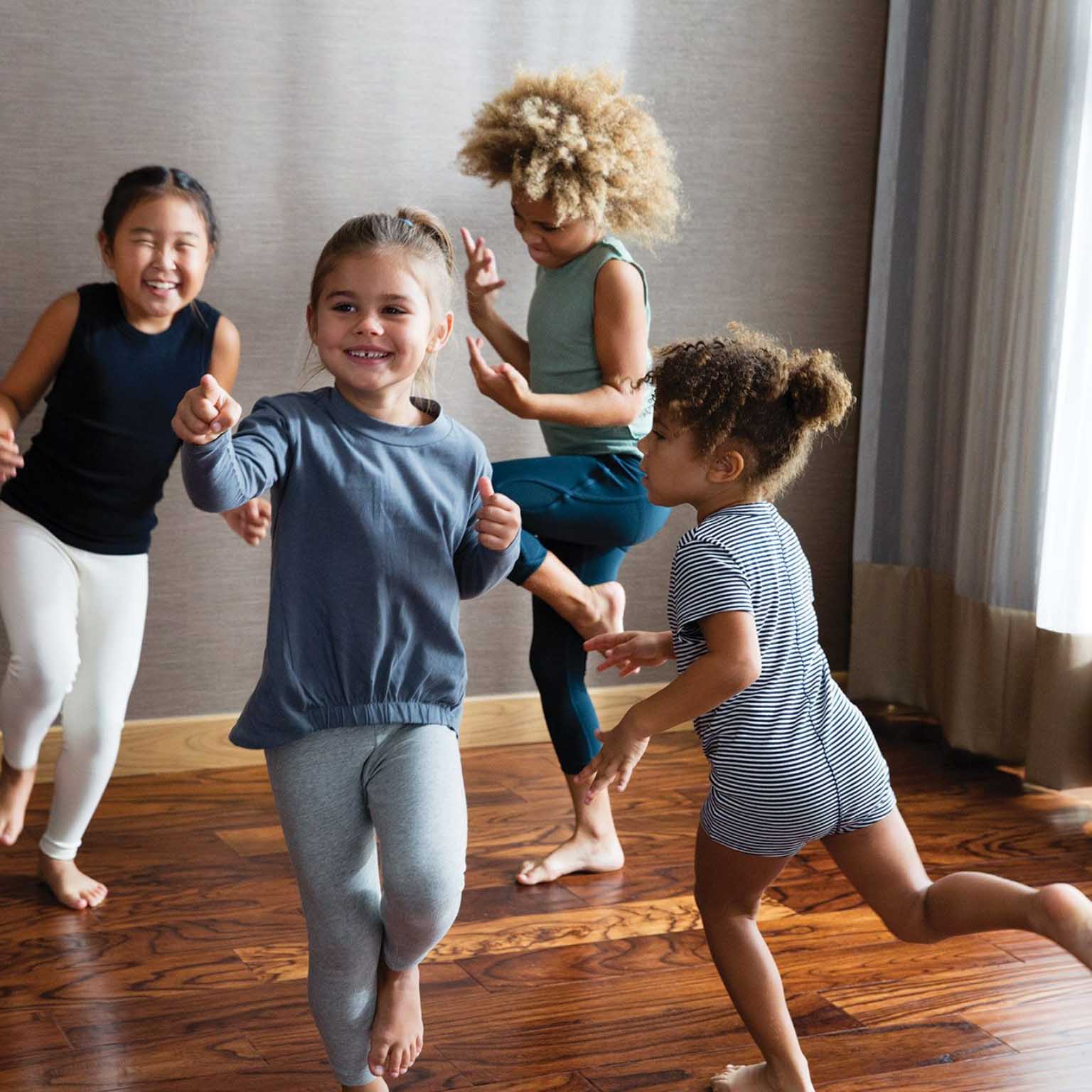 A group of children dancing together