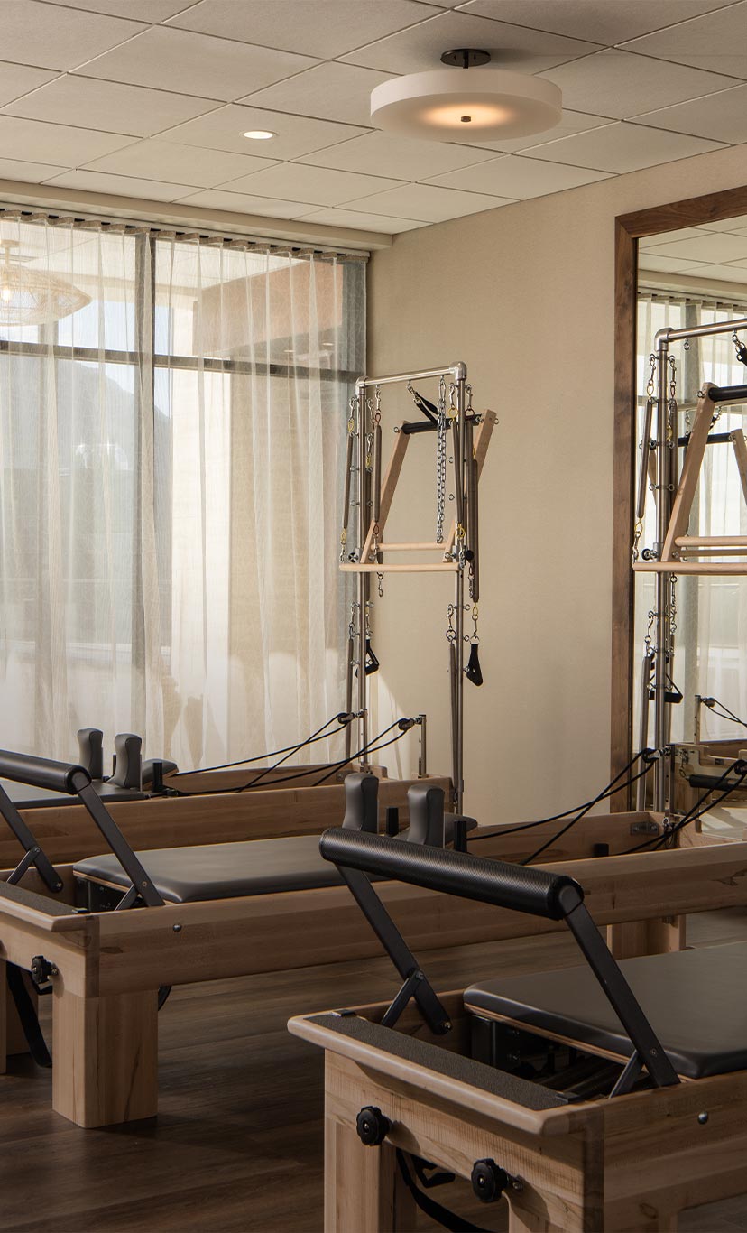 a group of woman in a pilates class