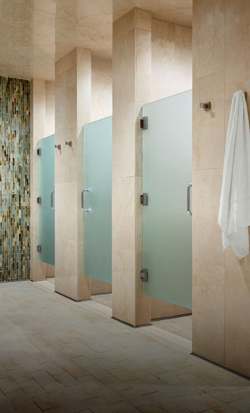 glass door and stone shower stalls