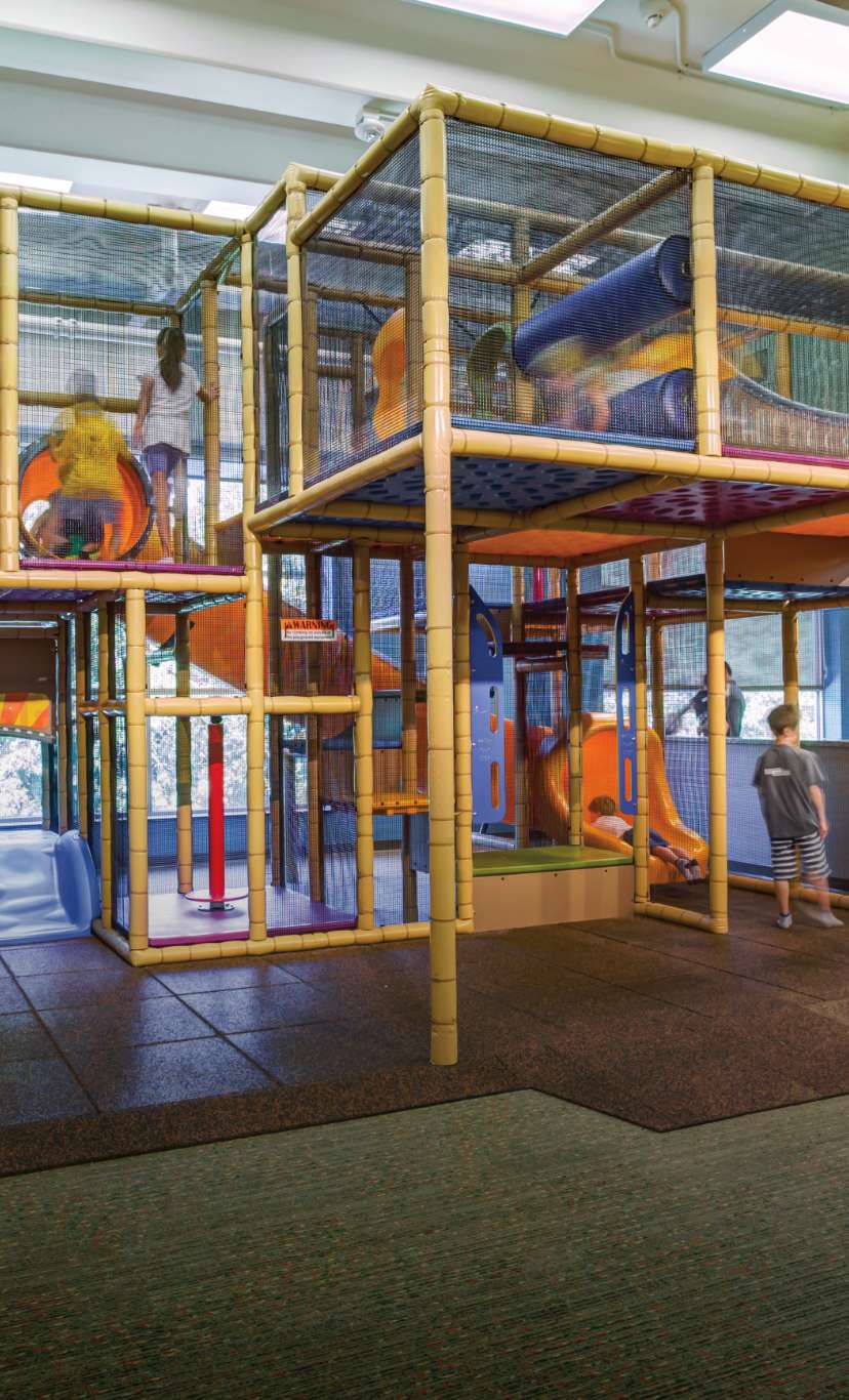 Kids climb in the play maze