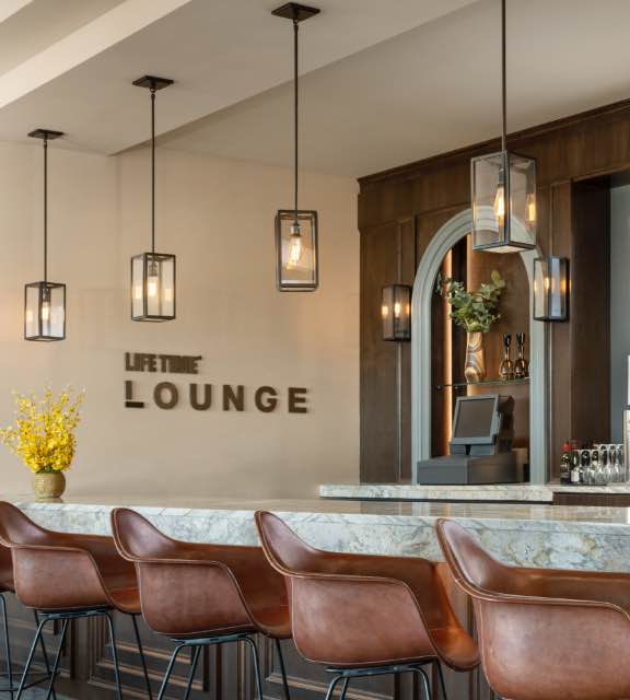 Bar and chairs at the lounge at Life Time Rancho San Clemente