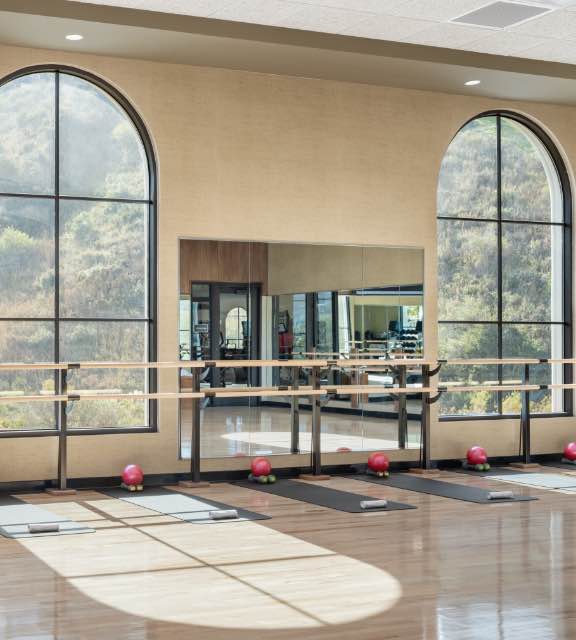 yoga mats and equipment in a group fitness studio