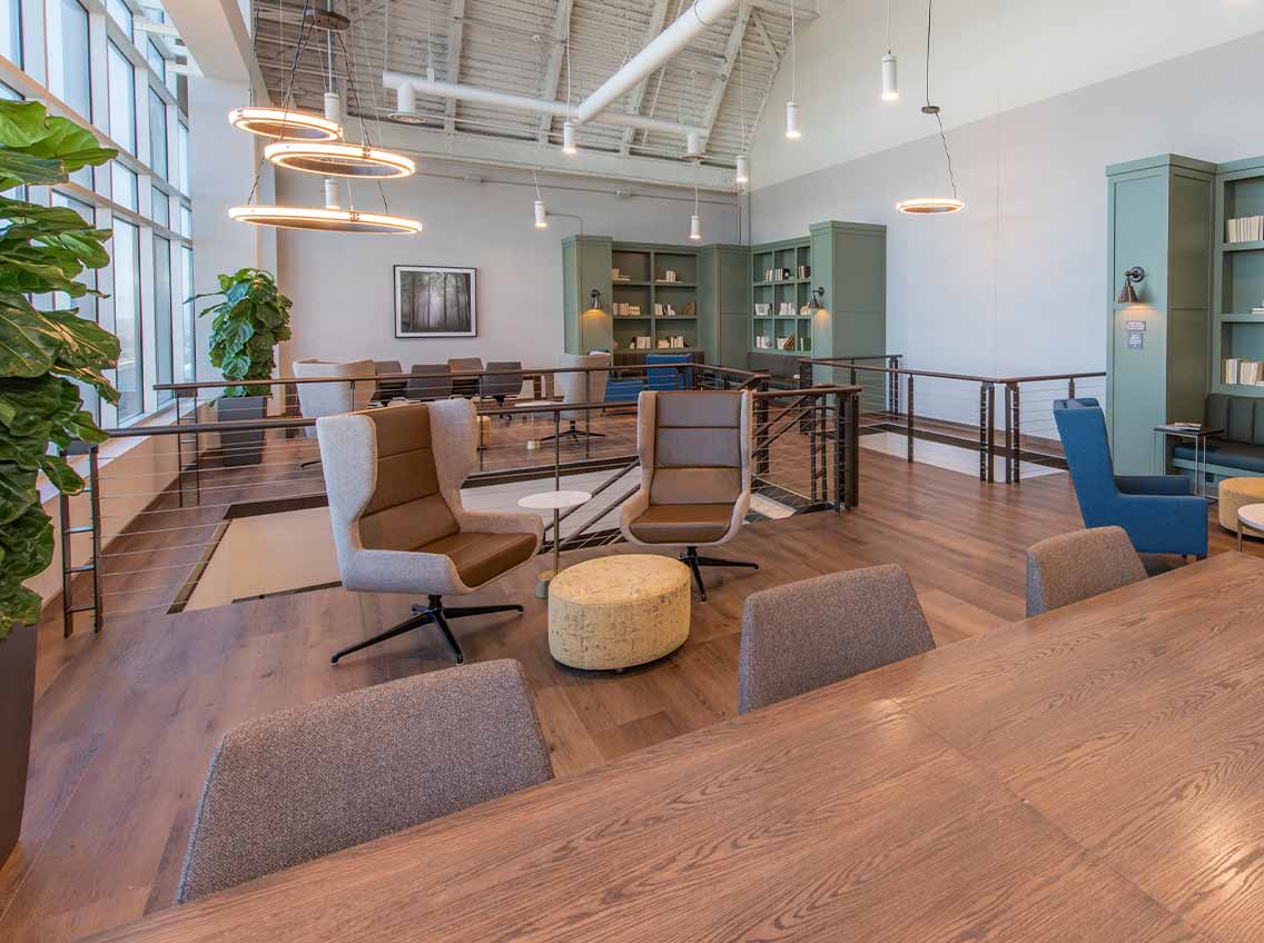 2 chairs and table in a well lit lounge area