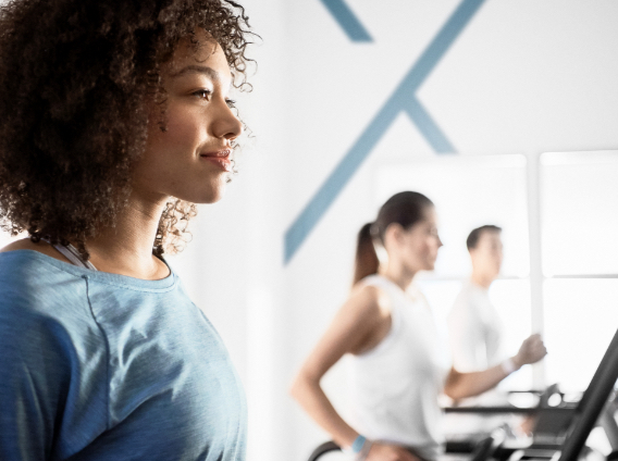 A small group working out on treadmills