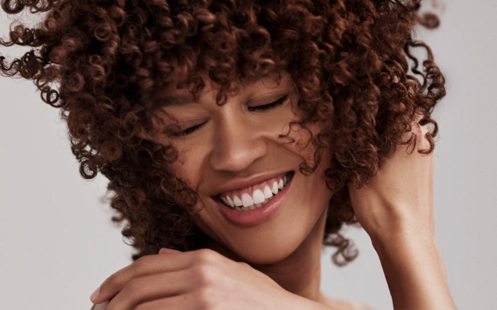 A close up of a woman smiling