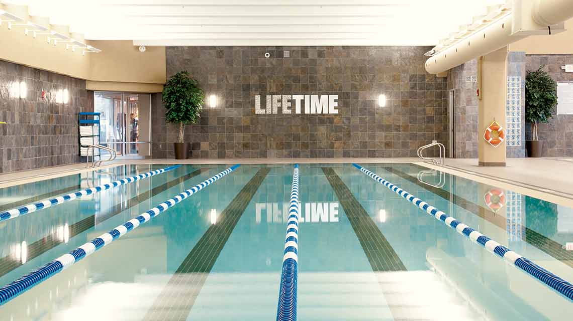 An indoor lap pool in a Life Time club