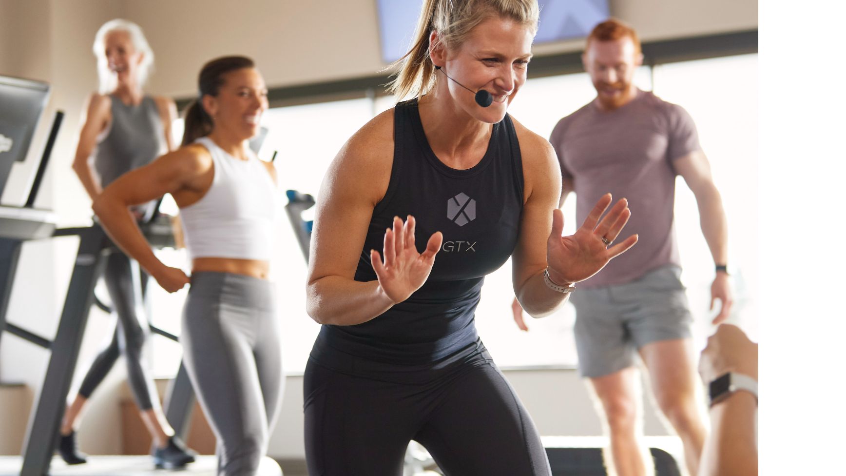 a GTX coach enthusiasticly coaches a group