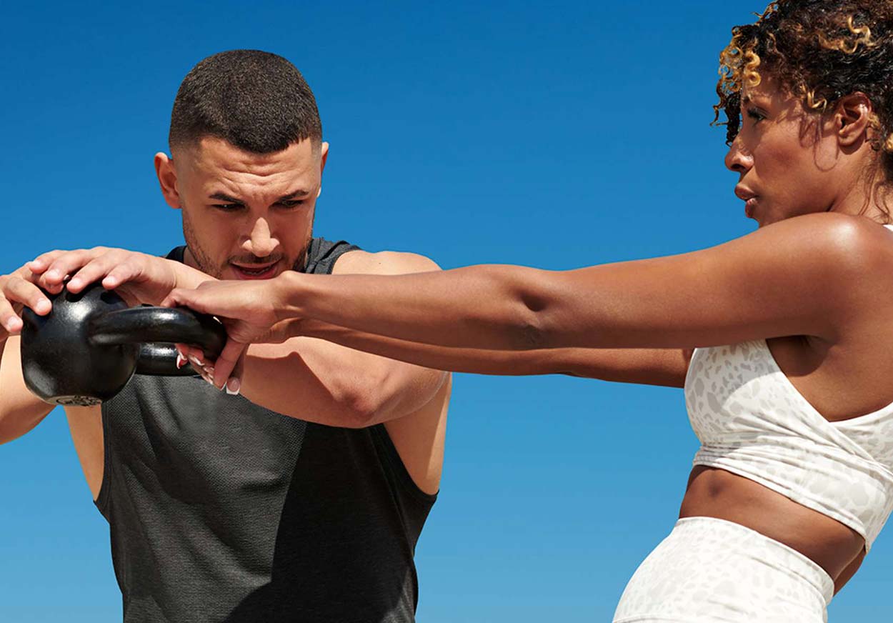 A woman working directly with her personal trainer