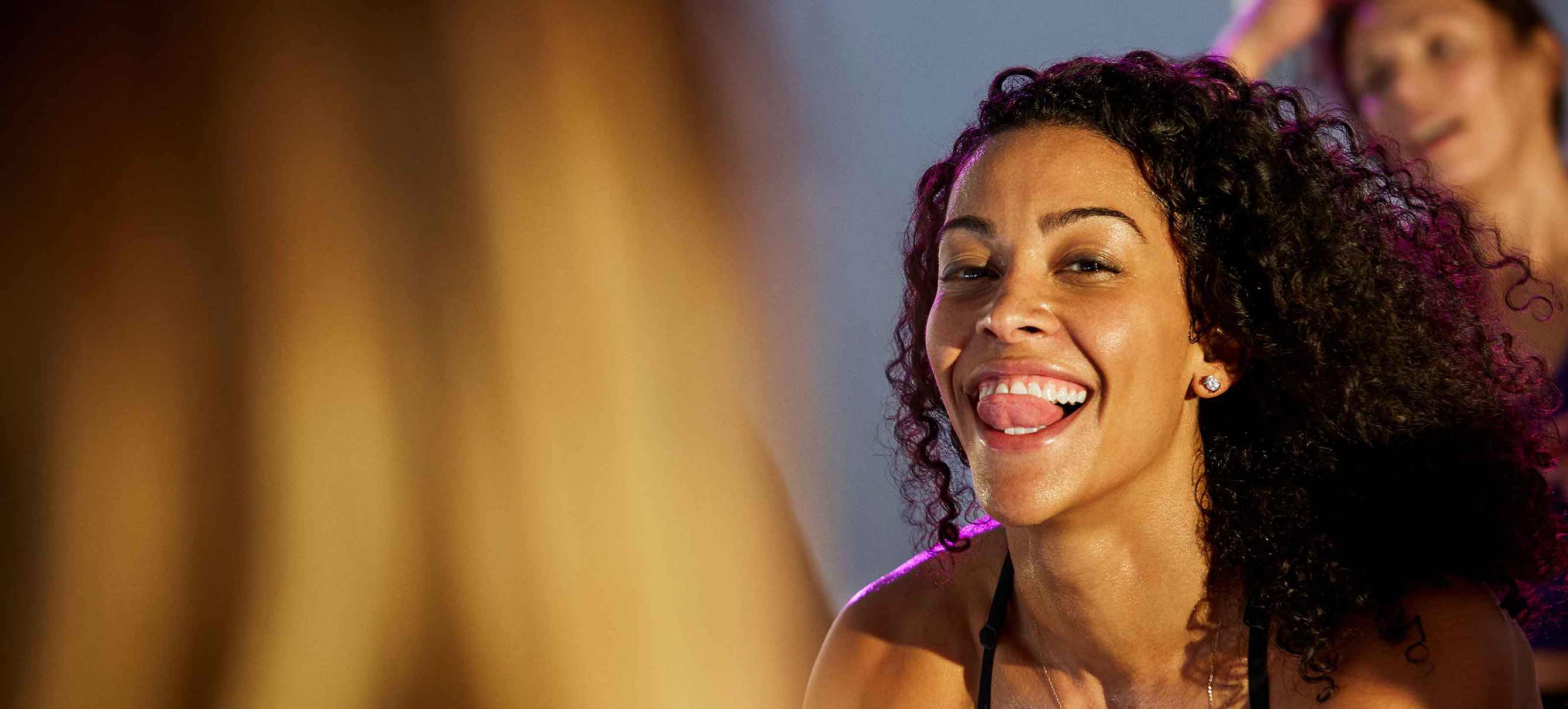 woman smiling while working out