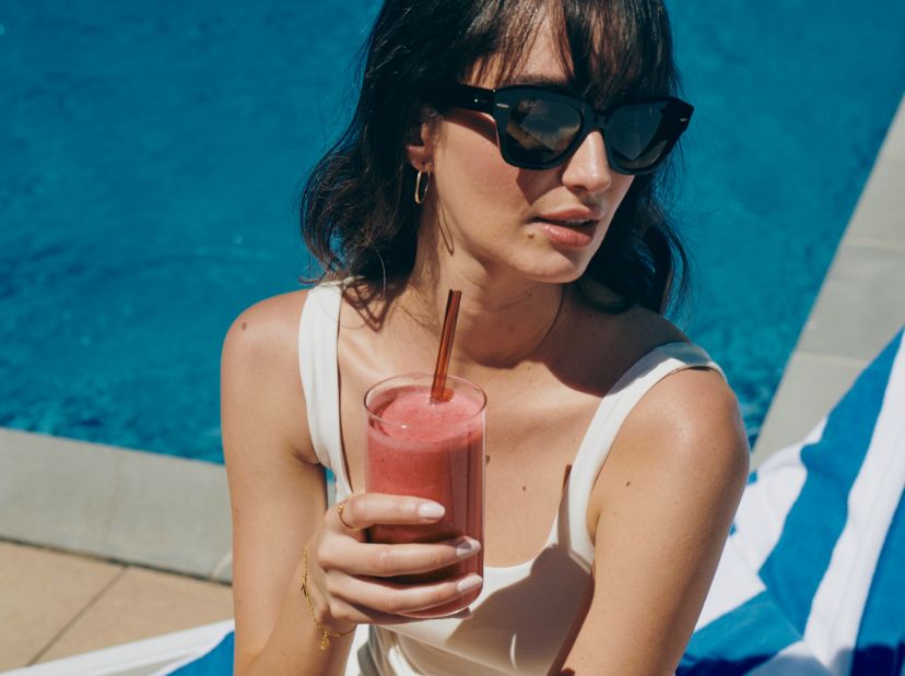 woman resting hand on shoulder