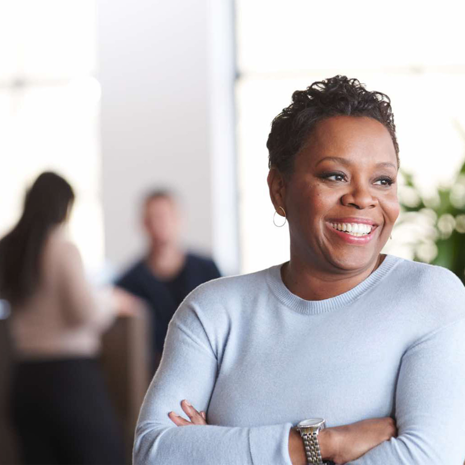 woman crossing her arms smiling