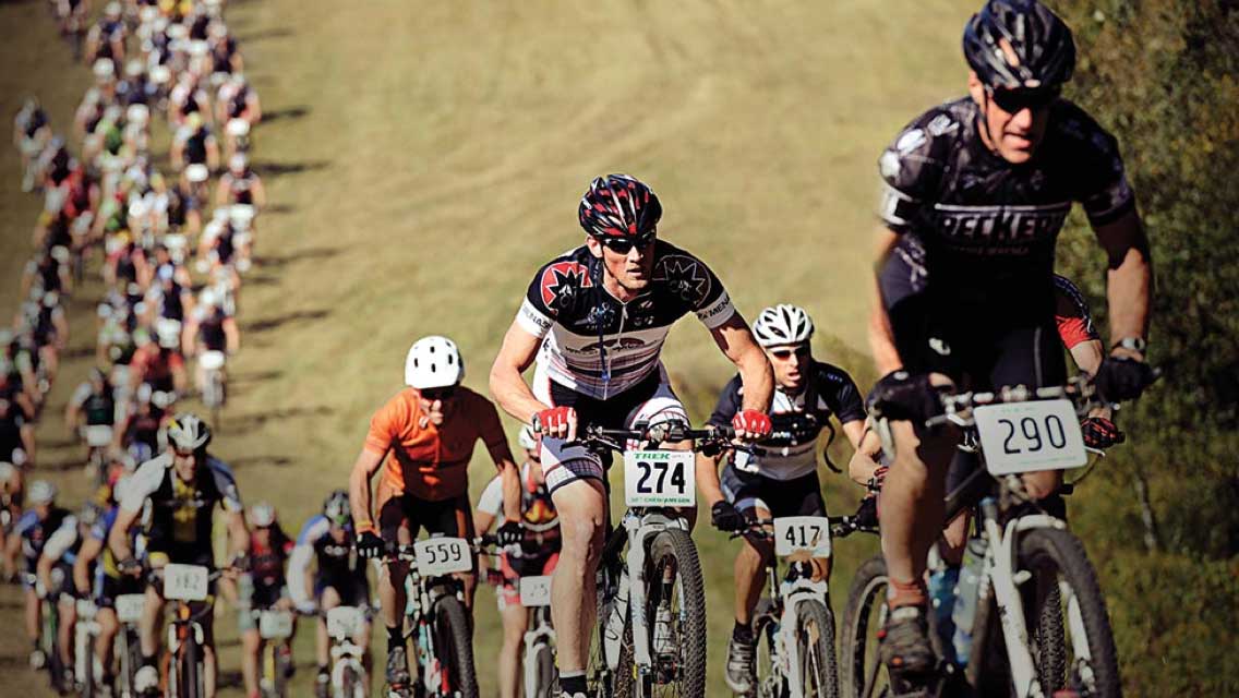 Group of cyclists participating in an outdoor cycle race